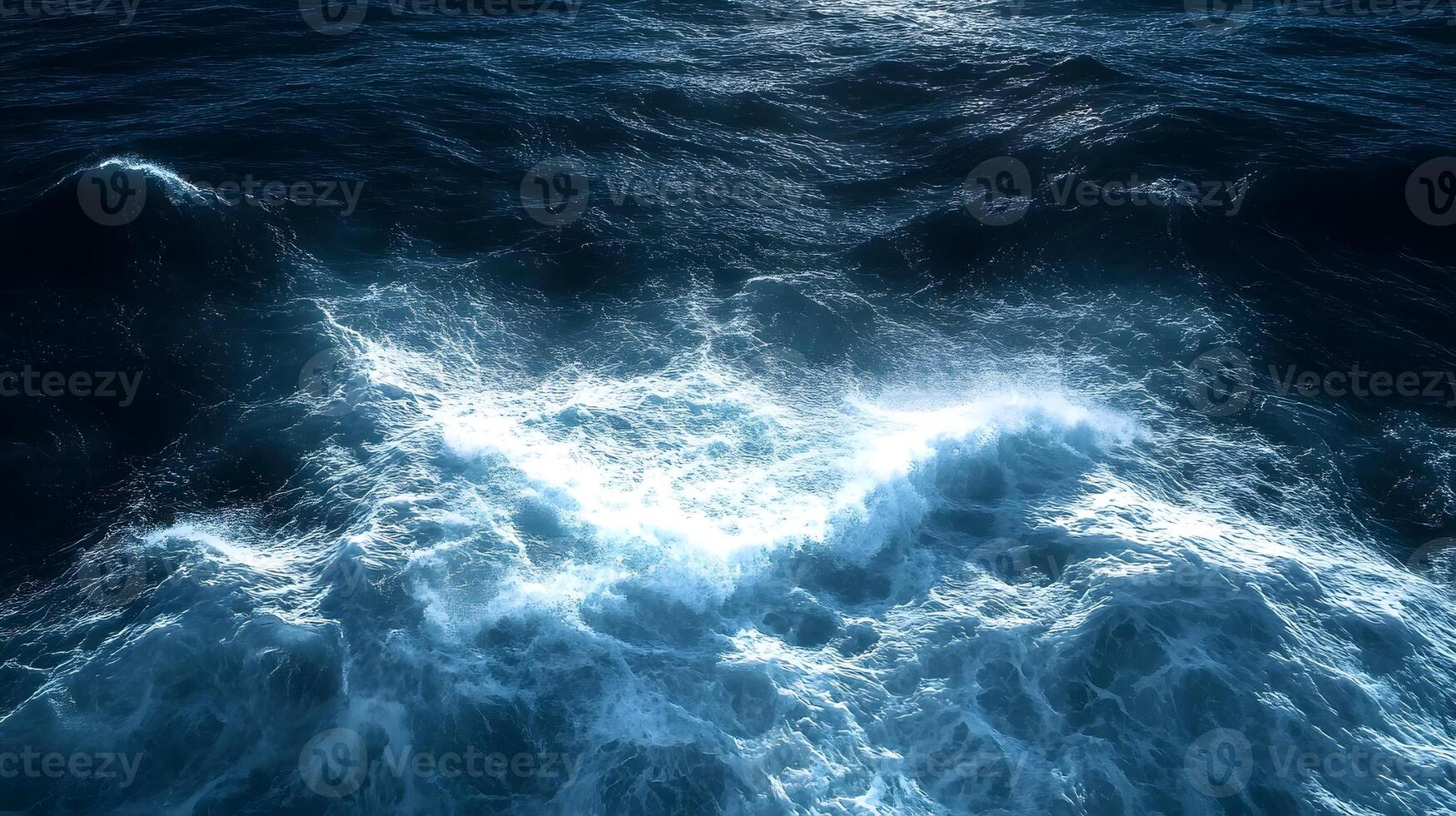 The ocean is seen from above with waves photo