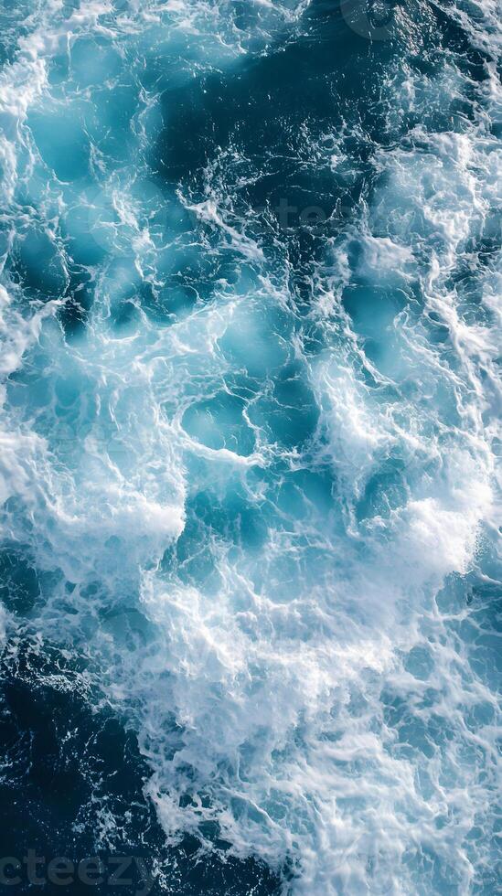 A view of the ocean from above with waves photo