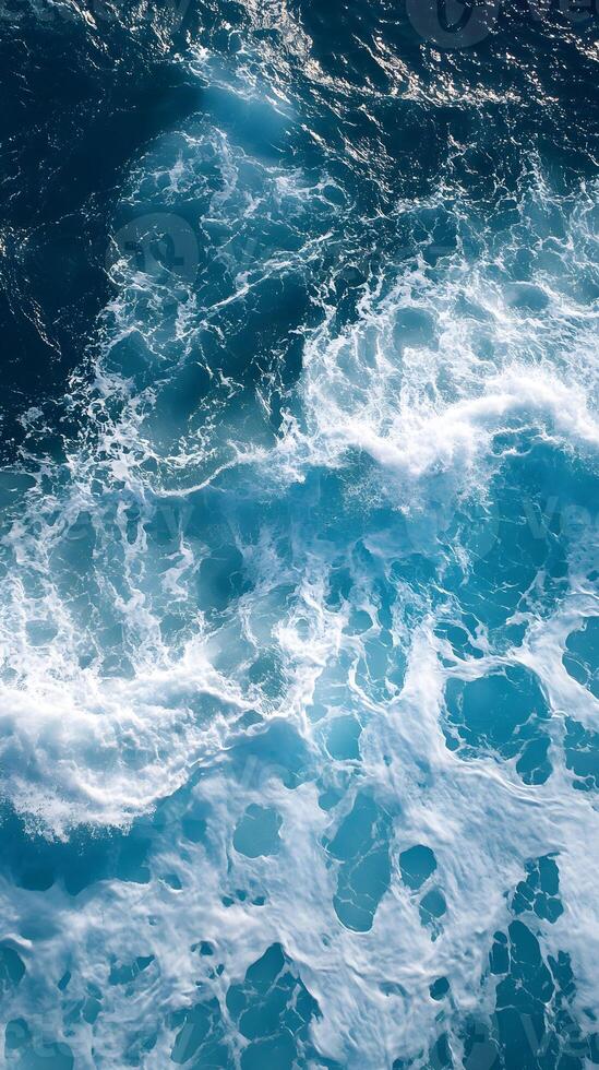 A view of the ocean from above with waves photo
