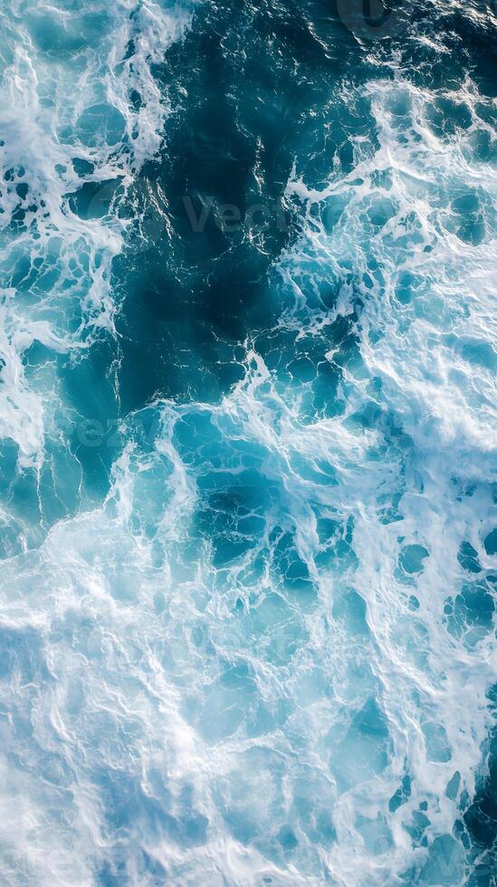 An aerial view of the ocean with waves photo
