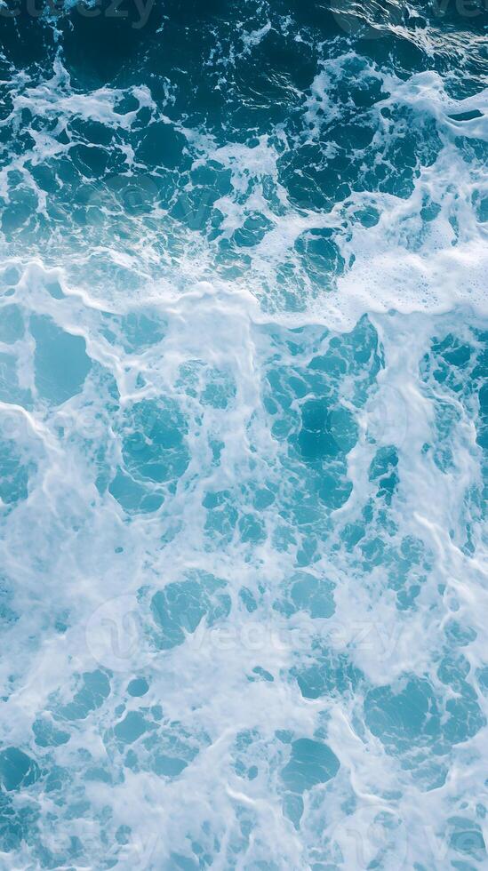 A view of the ocean with waves and foam photo