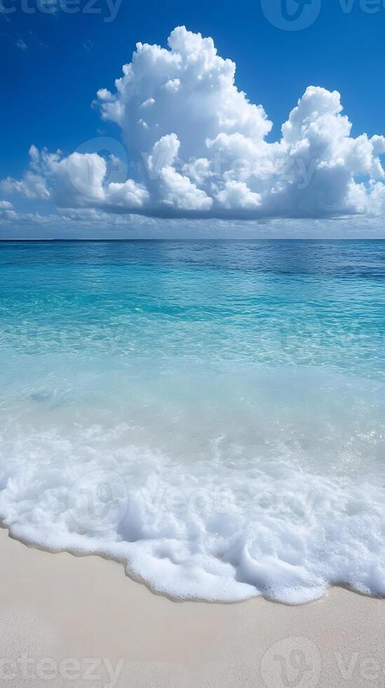 A beach with waves and clouds photo