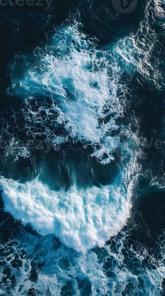 An aerial view of the ocean with waves photo
