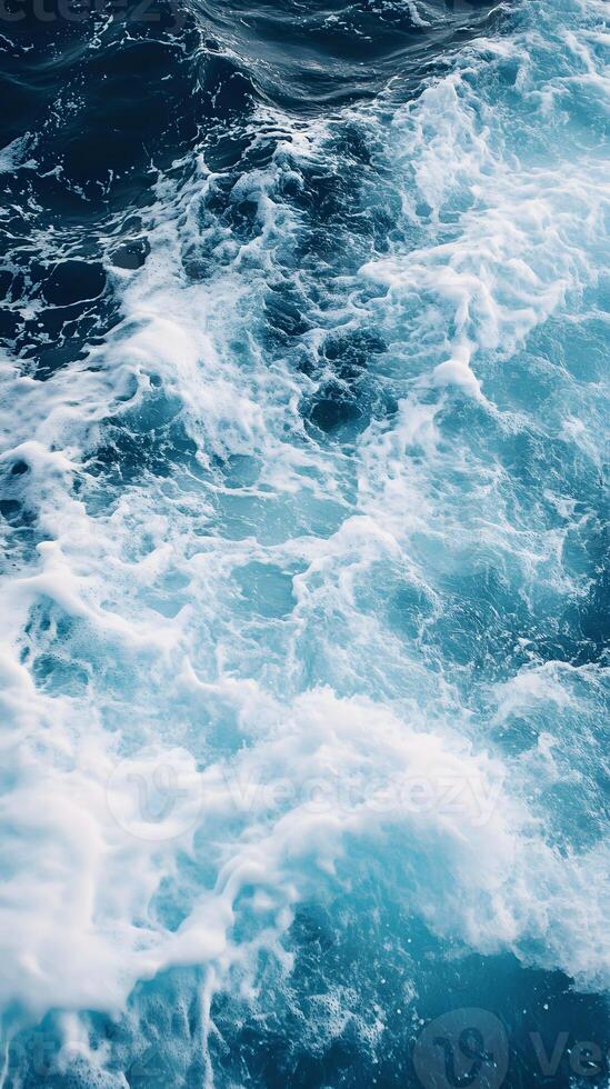 A close up of a wave in the ocean photo