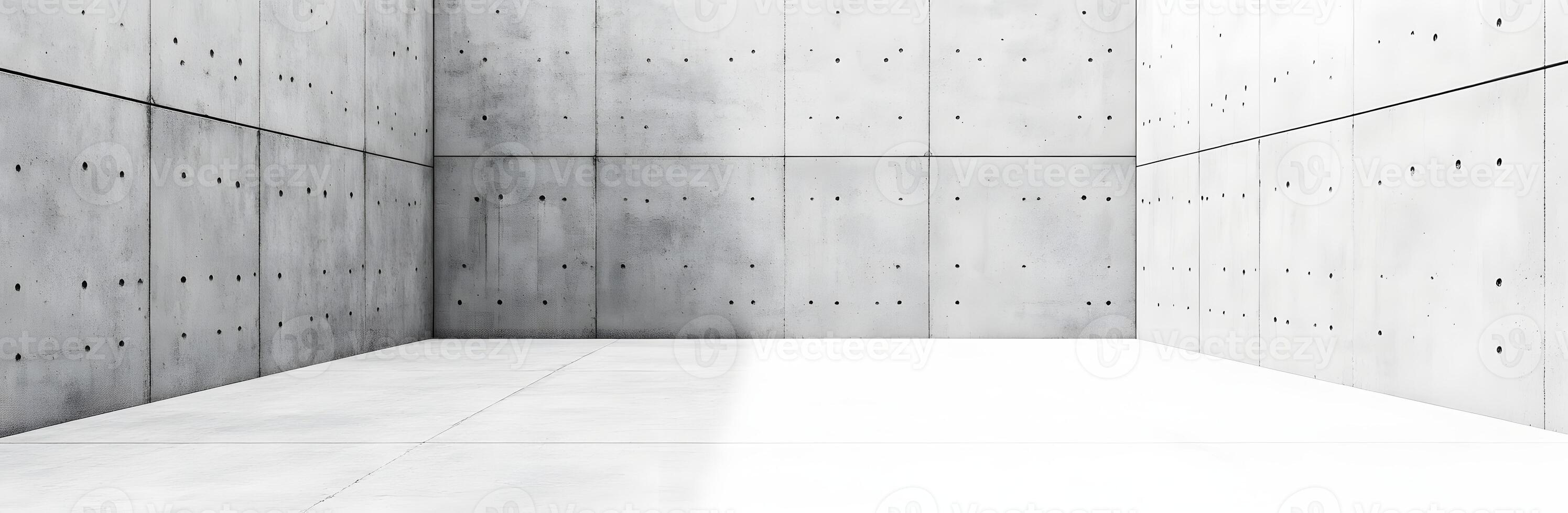A large room with concrete walls and a white floor photo