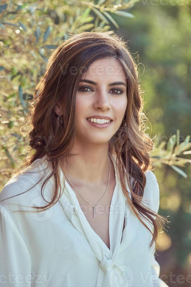 Attractive woman standing in nature photo