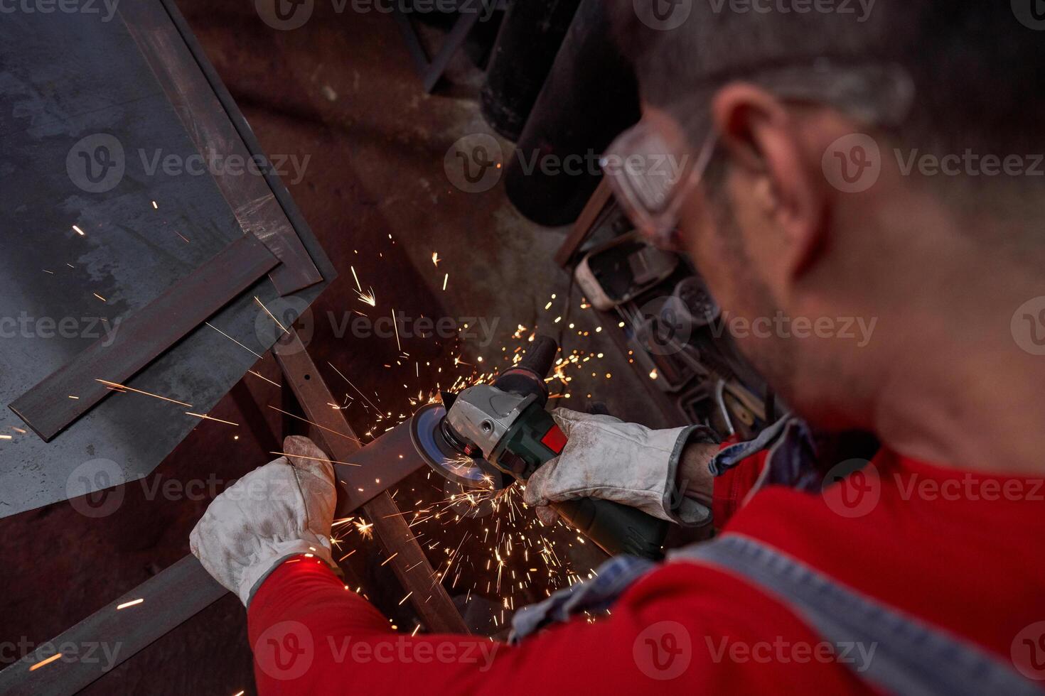 Man cutting metal plank on railing photo