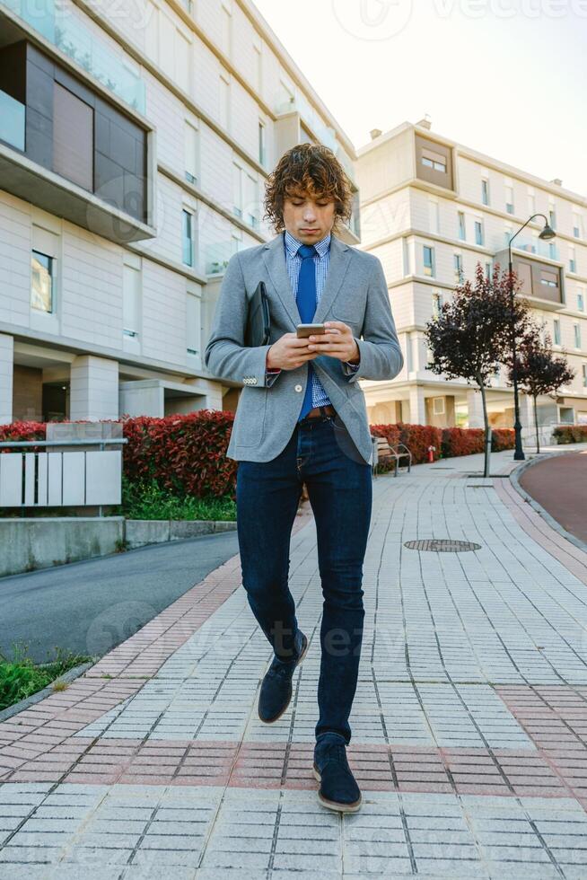 Businessman walking down the street photo
