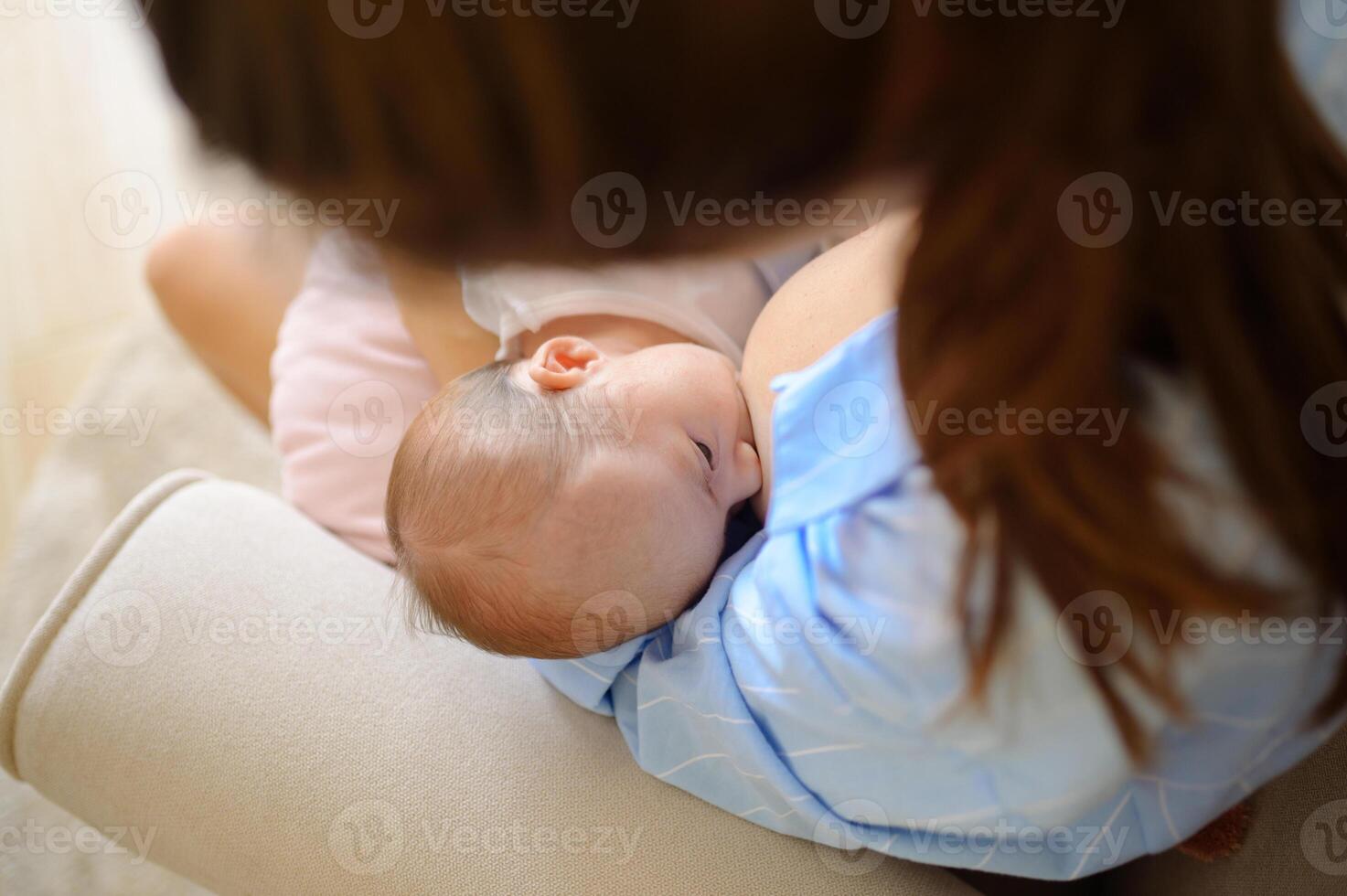 A woman holding a baby in her arms photo