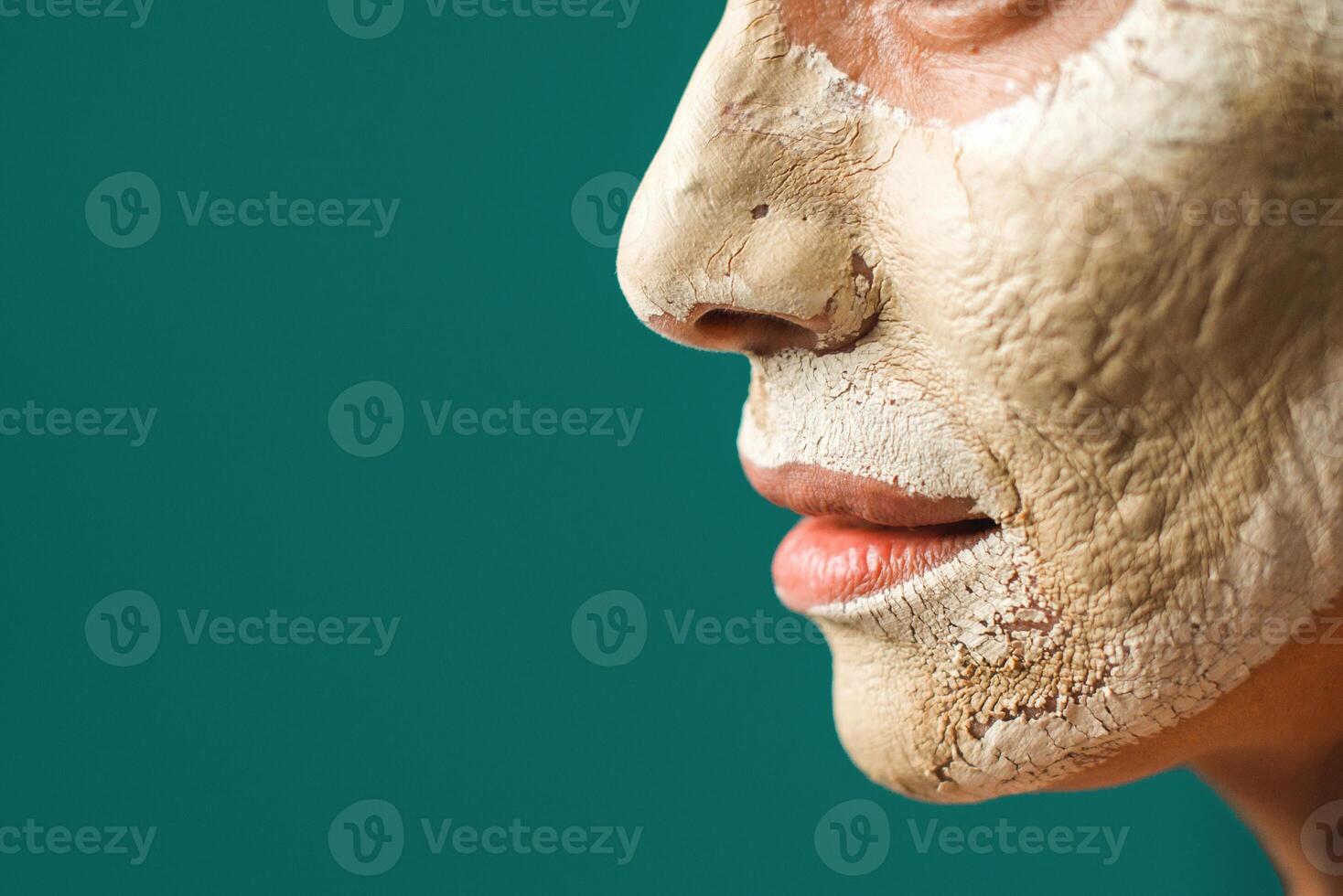 Crop woman with clay mask photo
