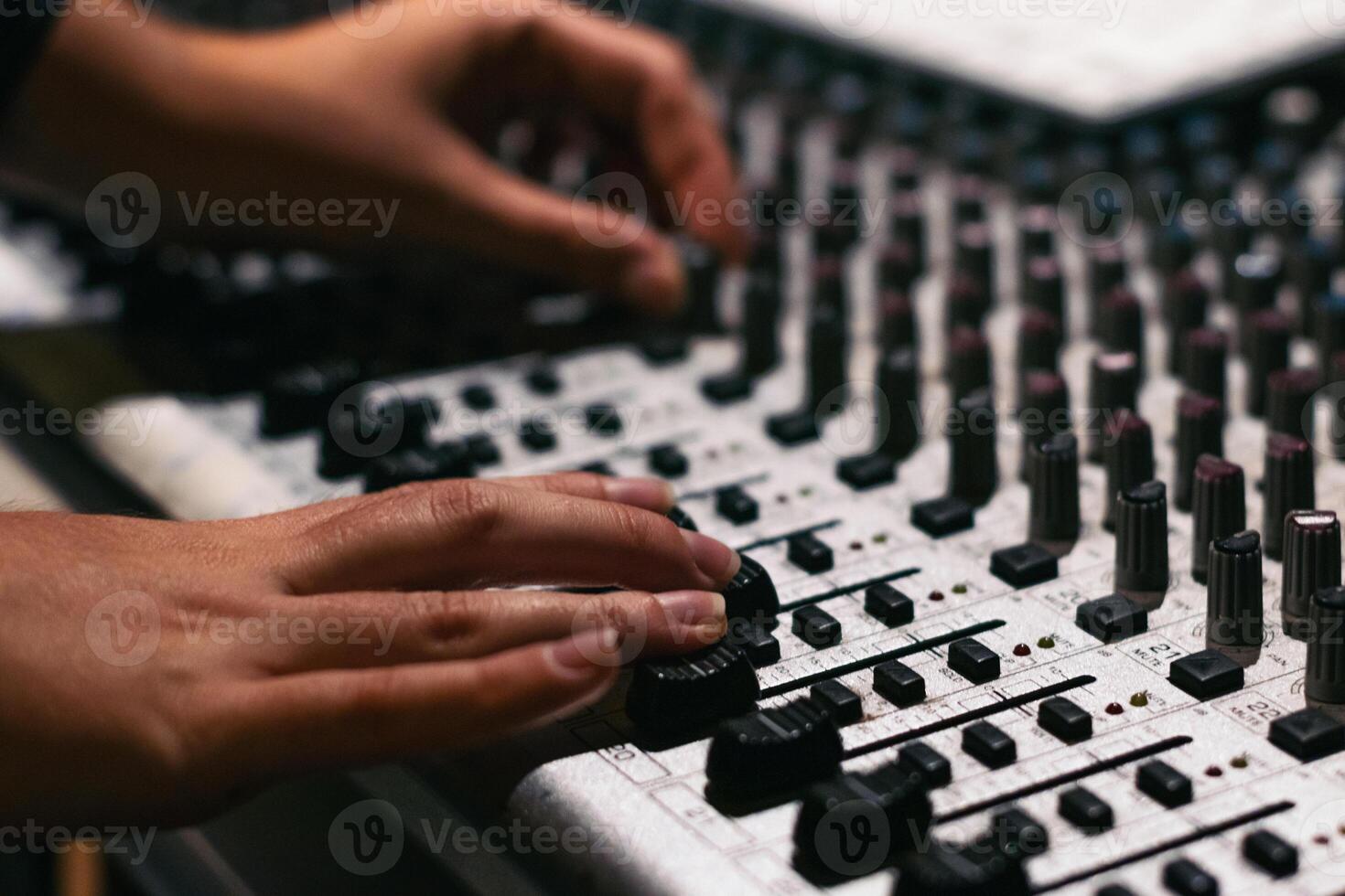 Hand Adjusts The Tone Of The Synthesizer photo