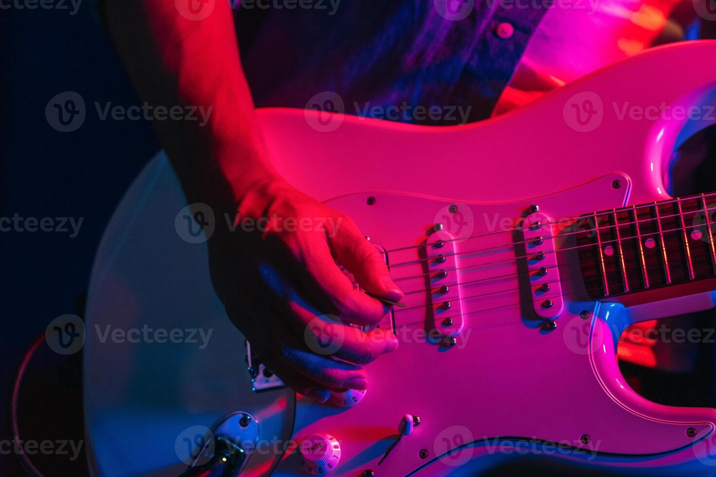 Musician Playing Electric Guitar During Live Concert photo
