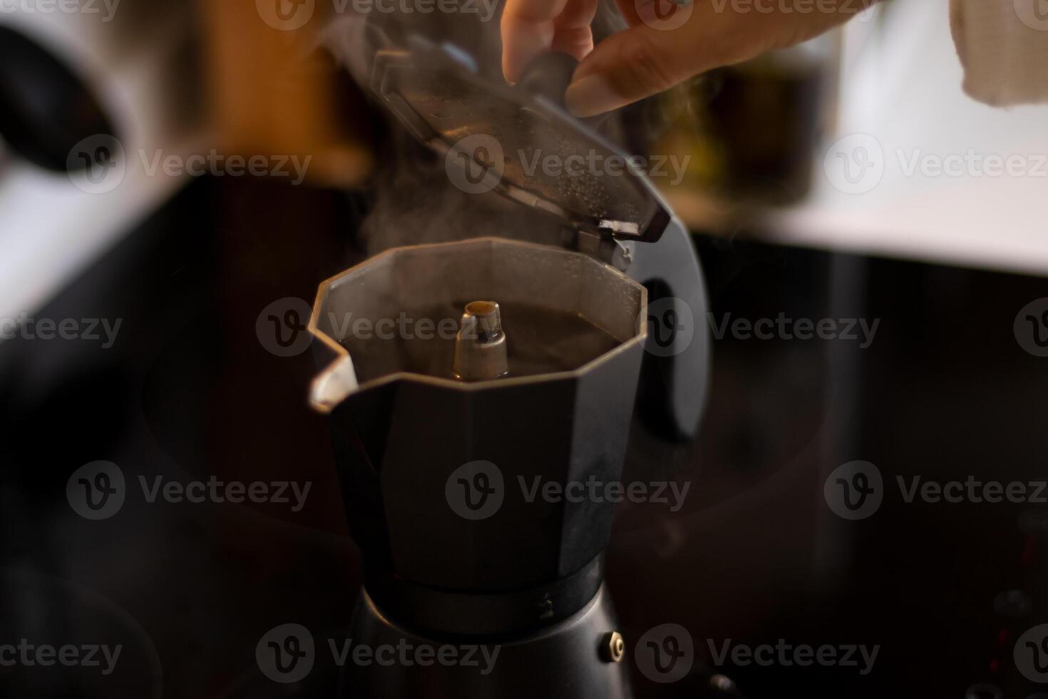 Making coffee in an italian coffee maker photo