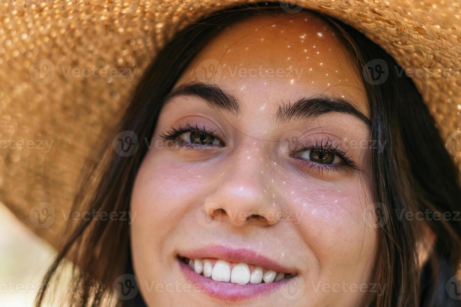 Portrait of a beautiful woman with a straw hat photo