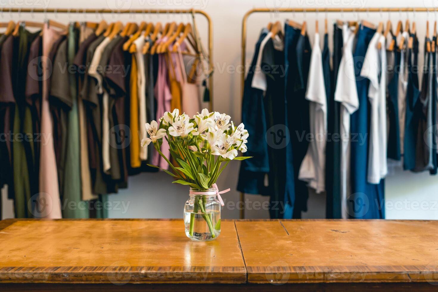 Clothes hanging on a rack in a showroom. Copy space photo