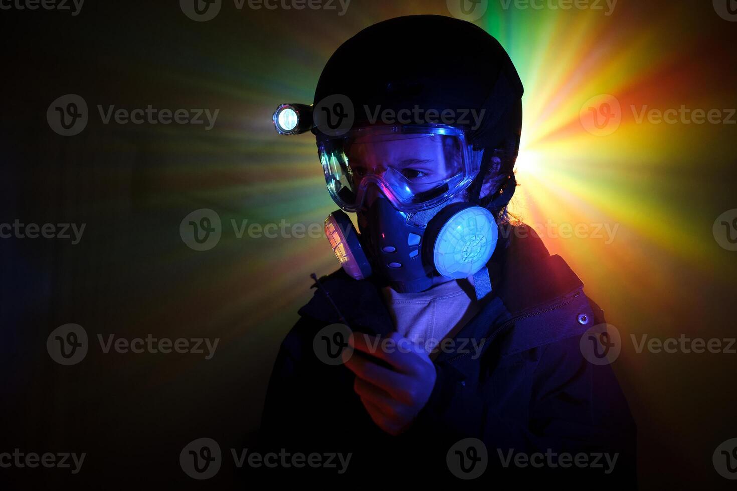 Boy using walking talkie while robbing dark mint photo