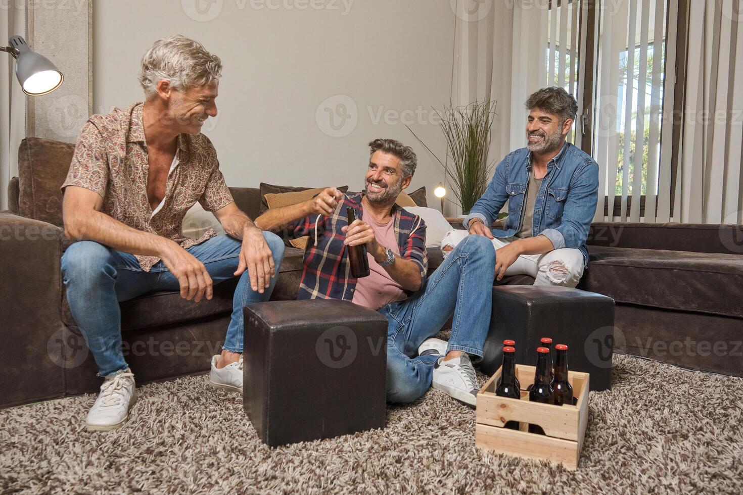 Adult brothers drinking beer with father photo