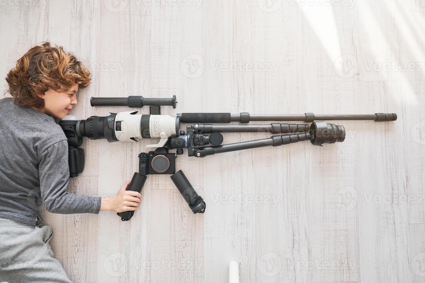 Playful boy looking in sight of rifle made with photography equi photo