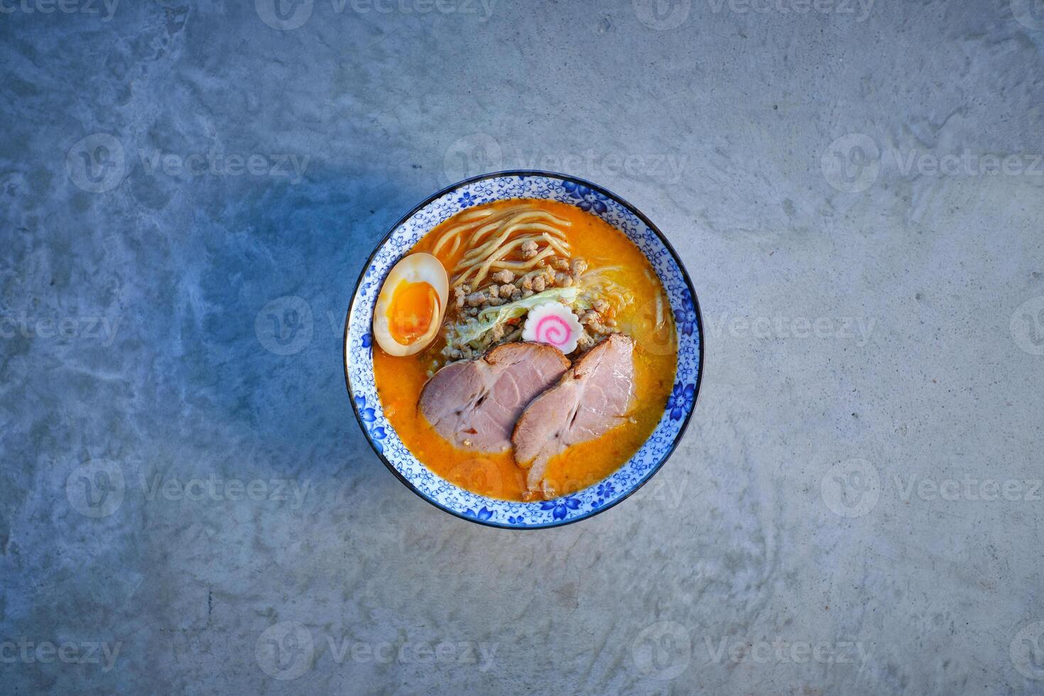 Delicious noodle soup with pork meat and egg in bowl photo