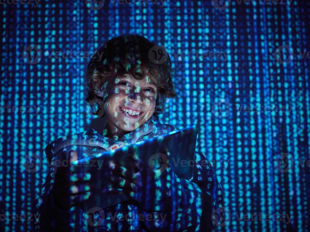 Cheerful hacker with digital tablet photo