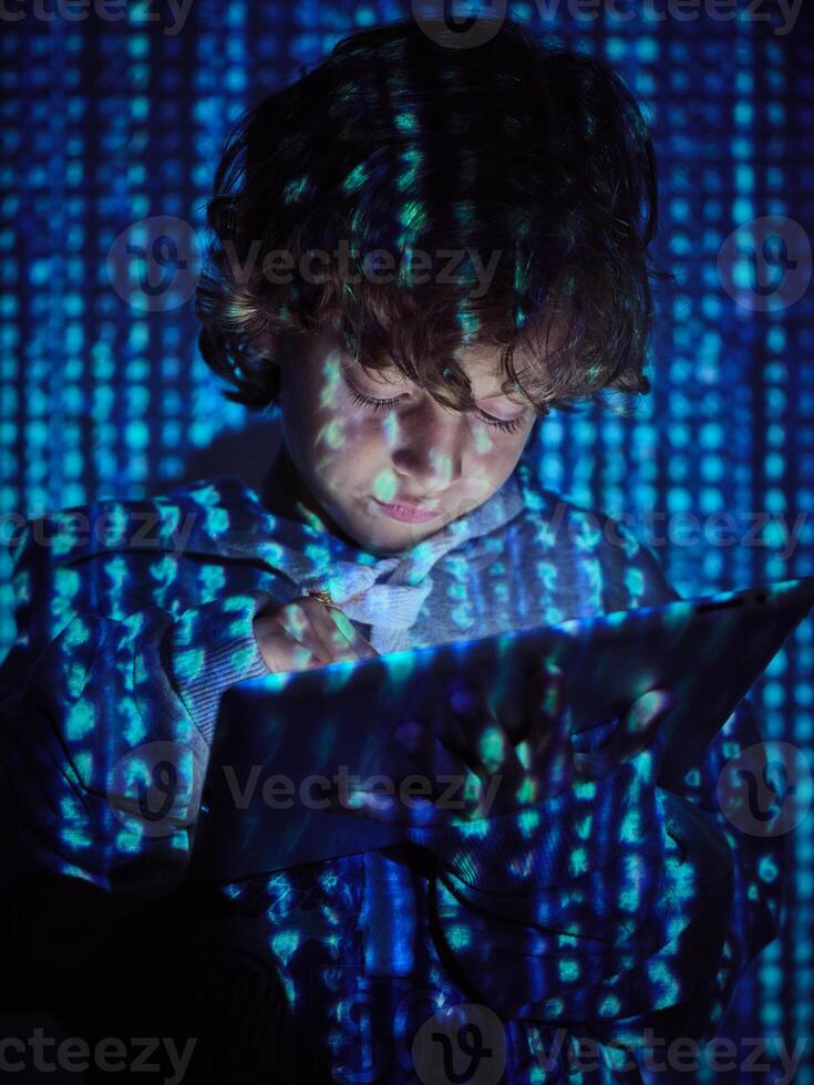 Hacker boy using digital tablet photo