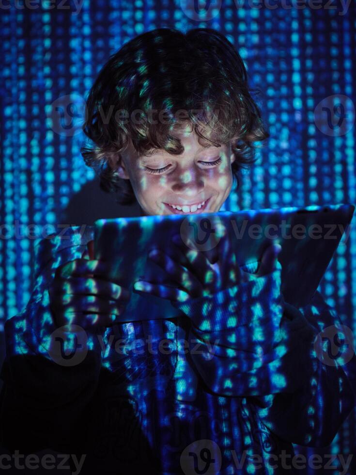 Smiling hacker with tablet on binary code background photo