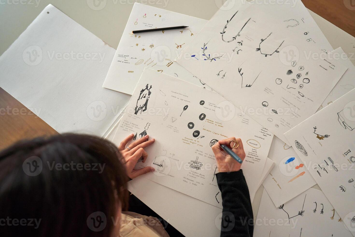 Designer creating draft of handmade accessories photo