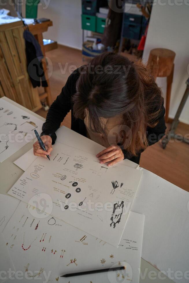 Creative designer drawing sketches of accessories photo