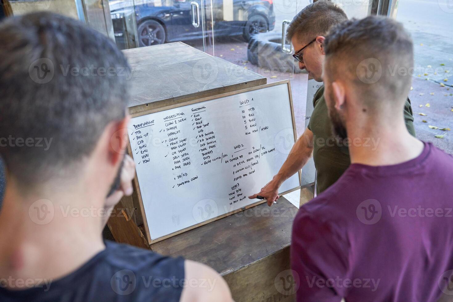 Unrecognizable men discussing project together photo