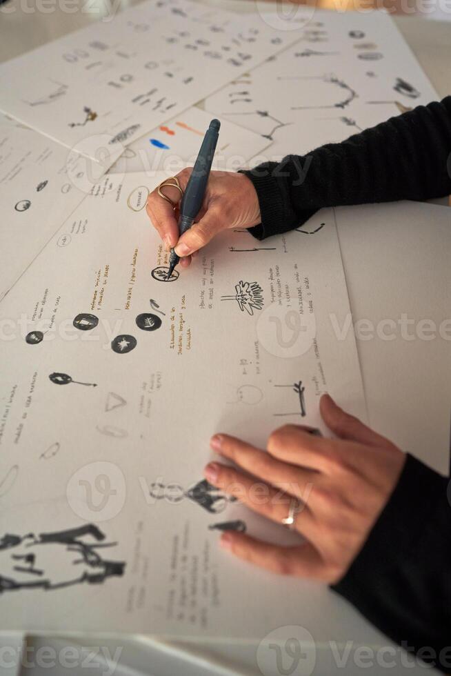 Designer drawing sketch on paper at workplace photo