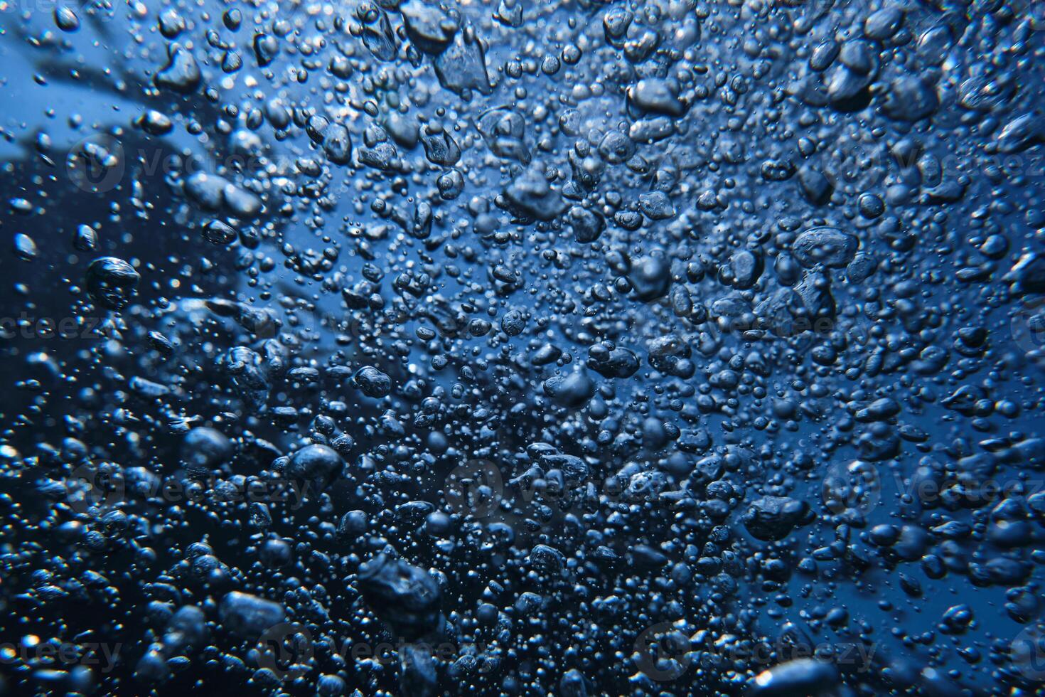 Background with air bubbles in water photo