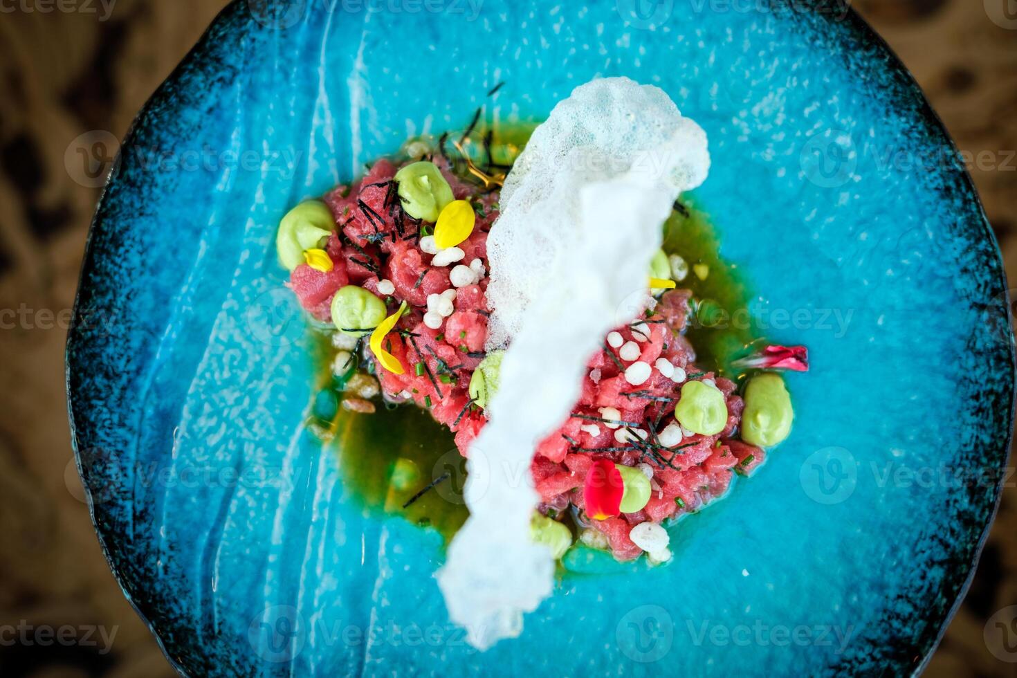 Sophisticated tuna tartare with prawn cracker photo