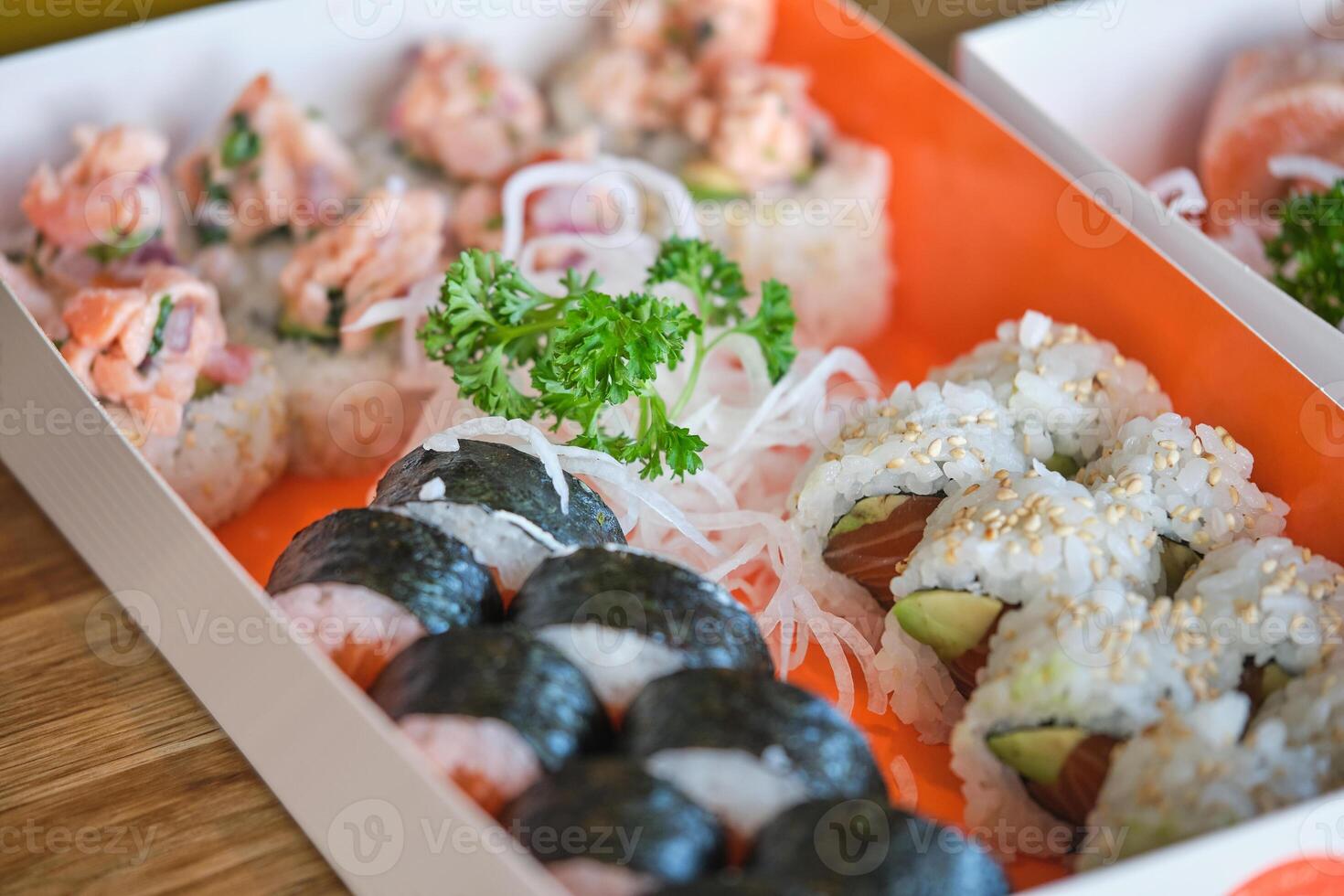 Assorted sushi rolls in box photo