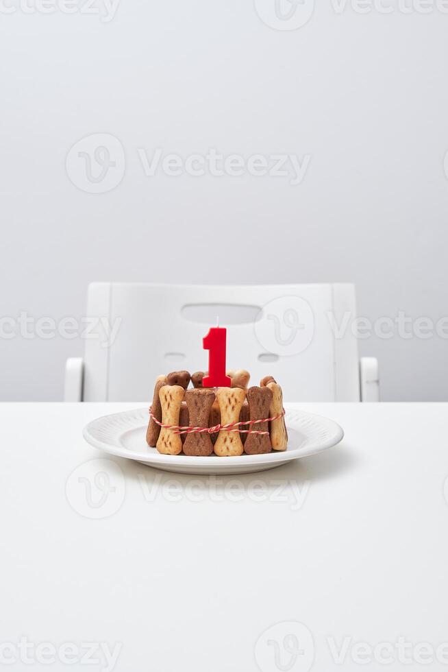Delicious cake with candle on table photo
