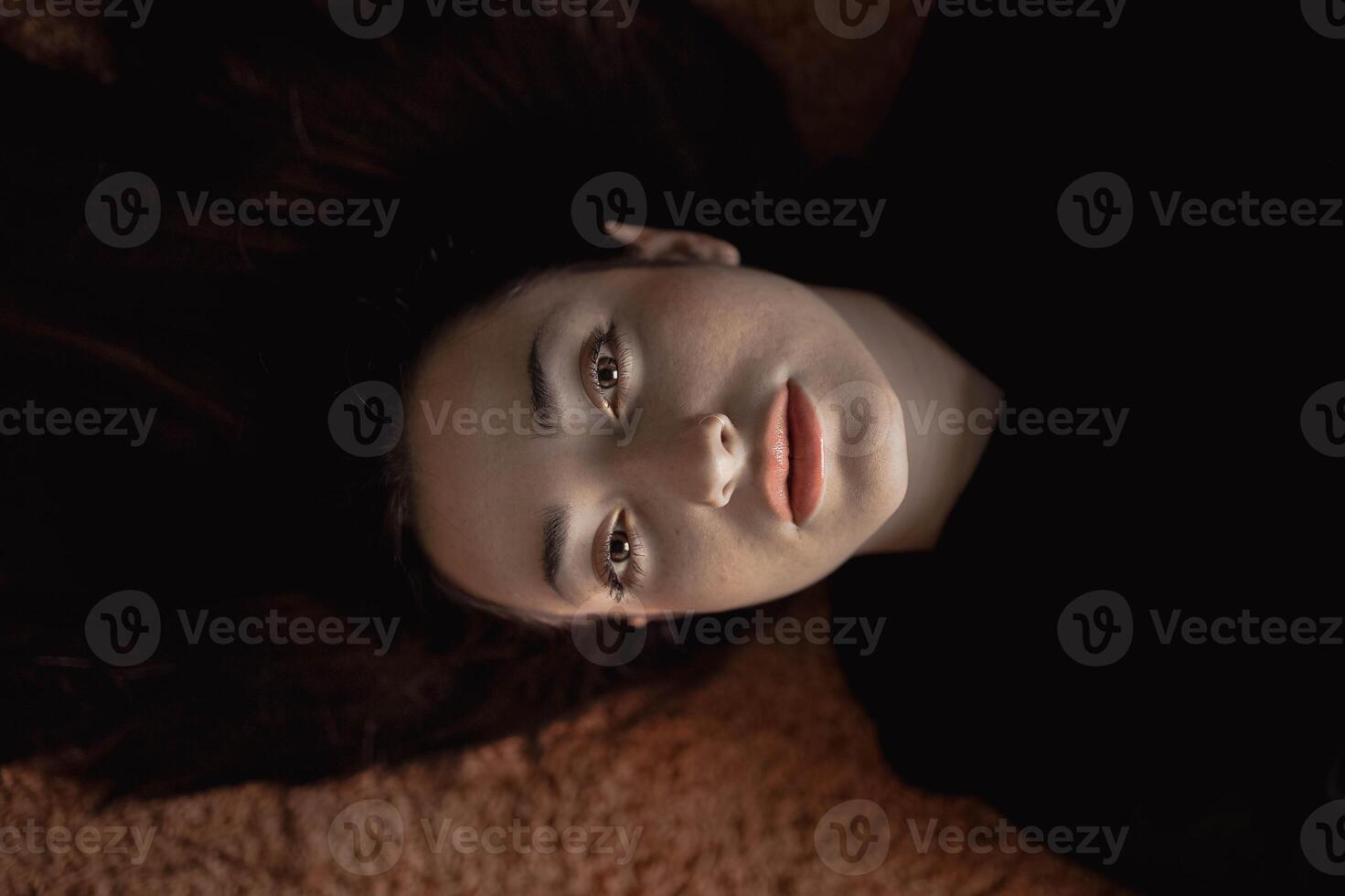 Attractive young woman on floor photo