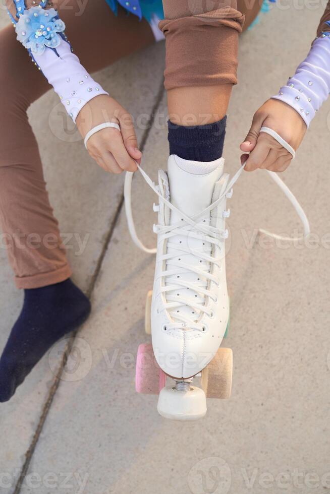 Anonymous person putting on roller skates photo