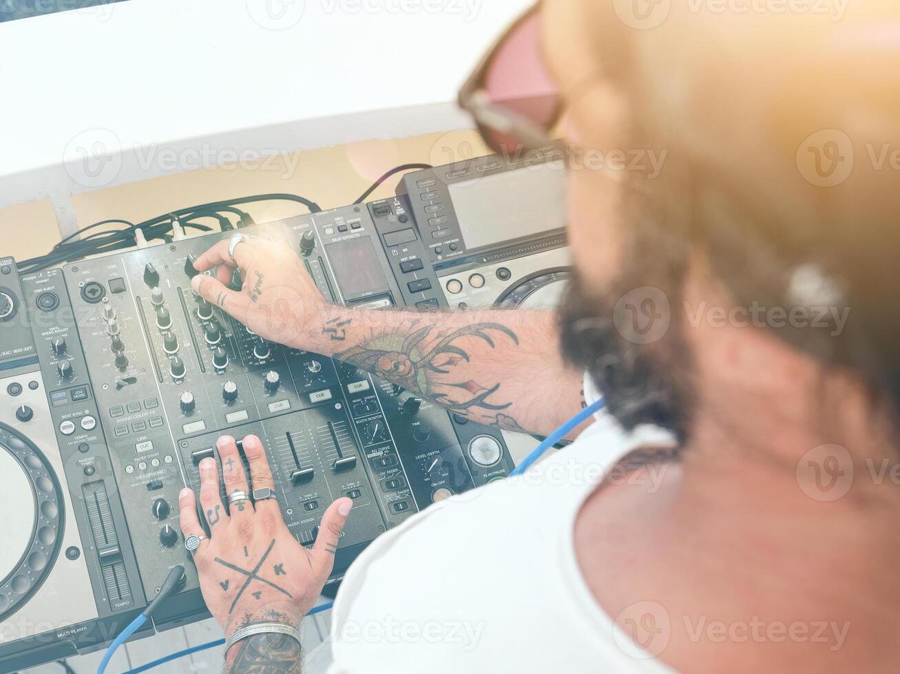 Disc jockey using control panel for creating music photo