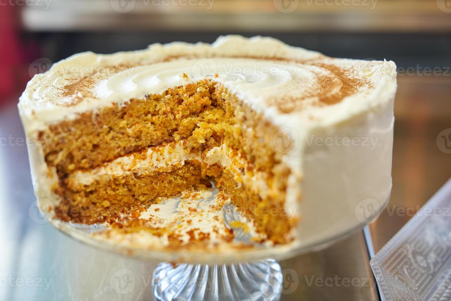 Sliced cake placed on glassware on table photo