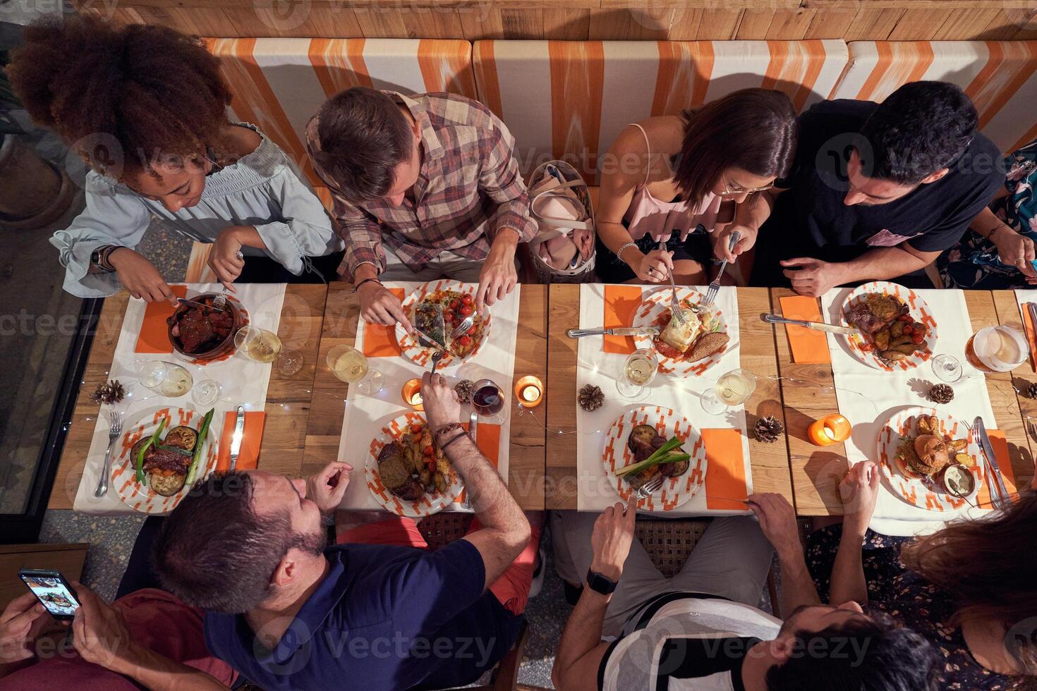 Group of diverse friends having dinner photo