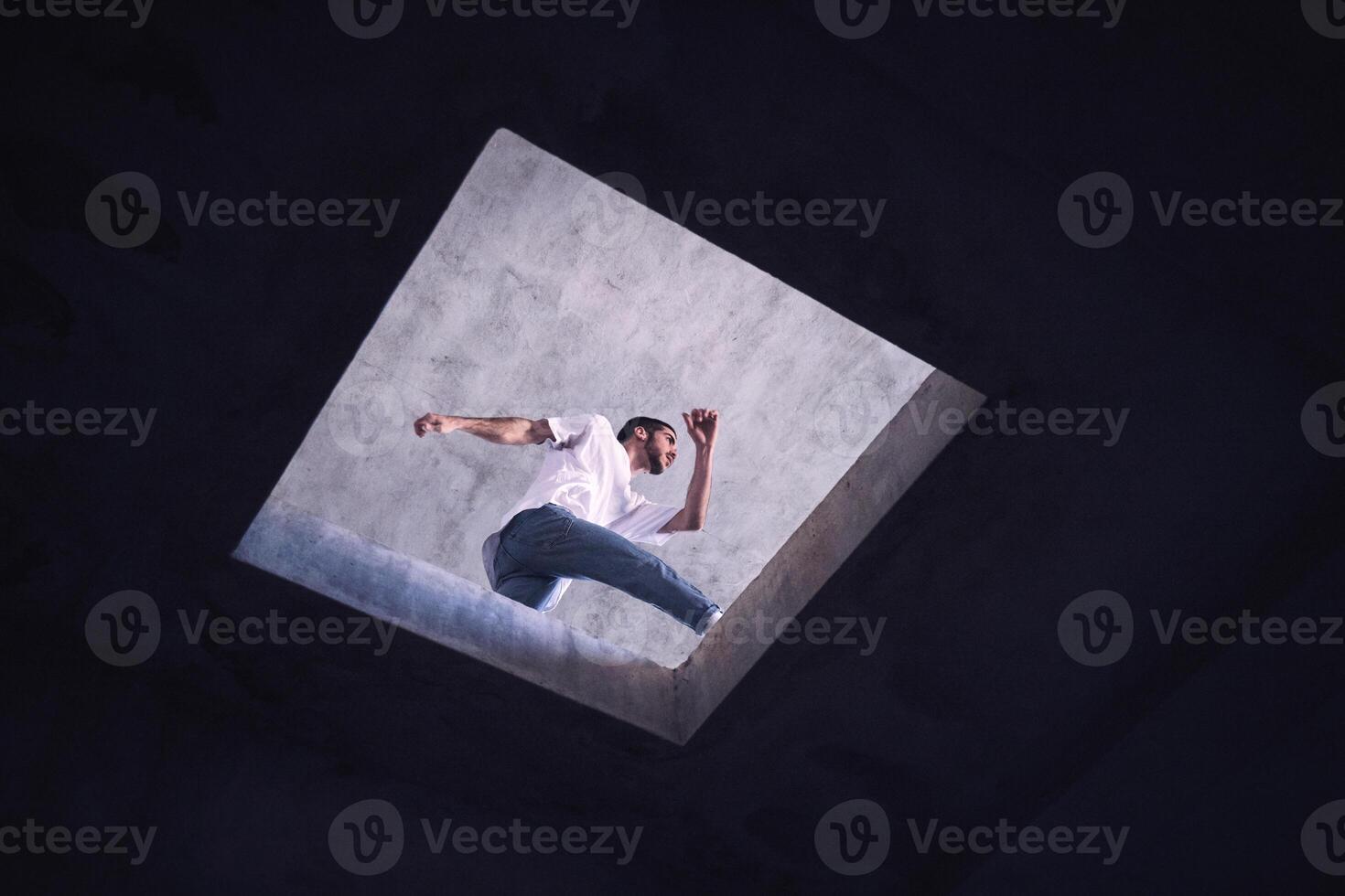 Anonymous man dancing near floor opening photo