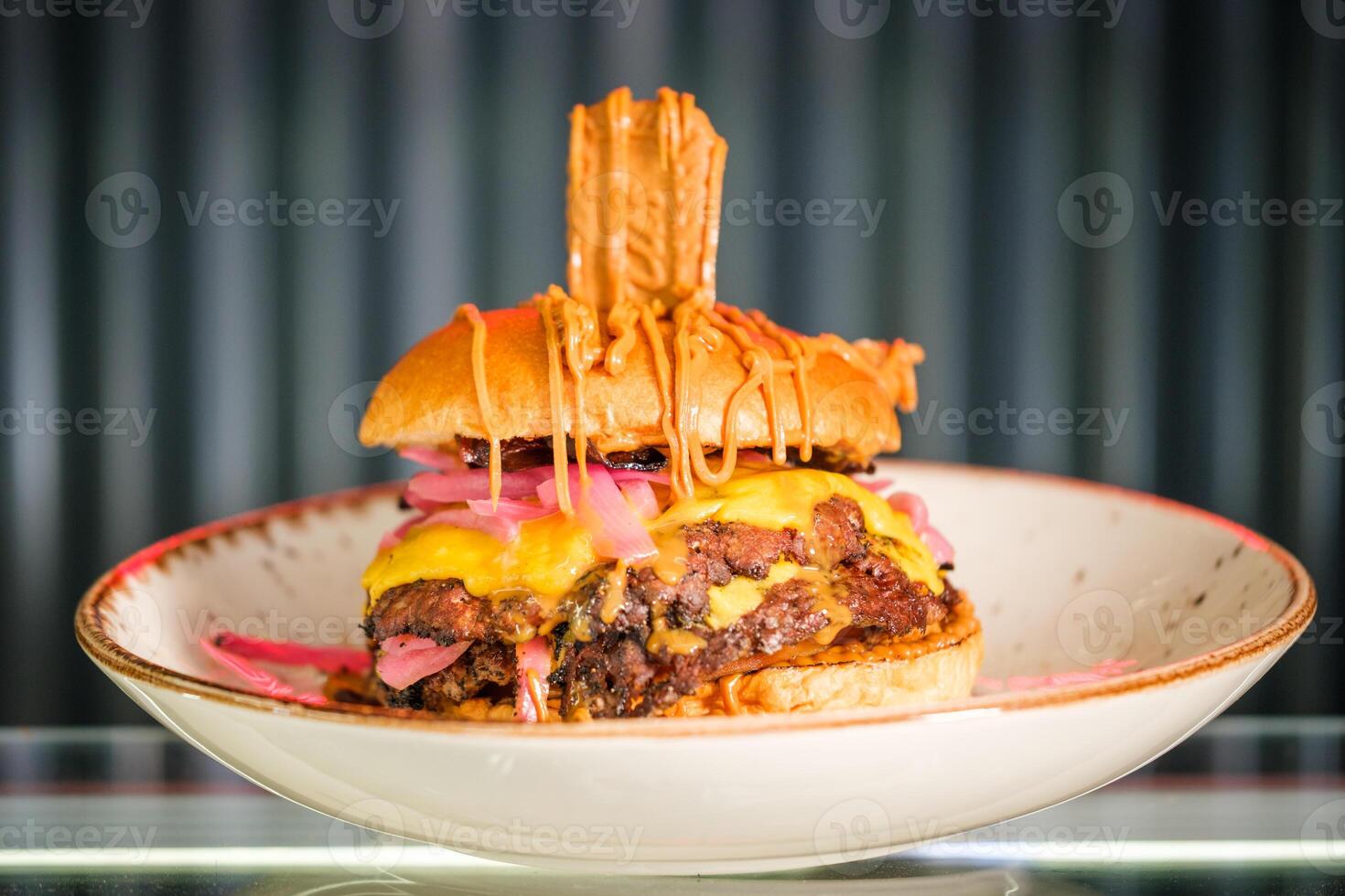 Appetizing hamburger on plate in cafe photo