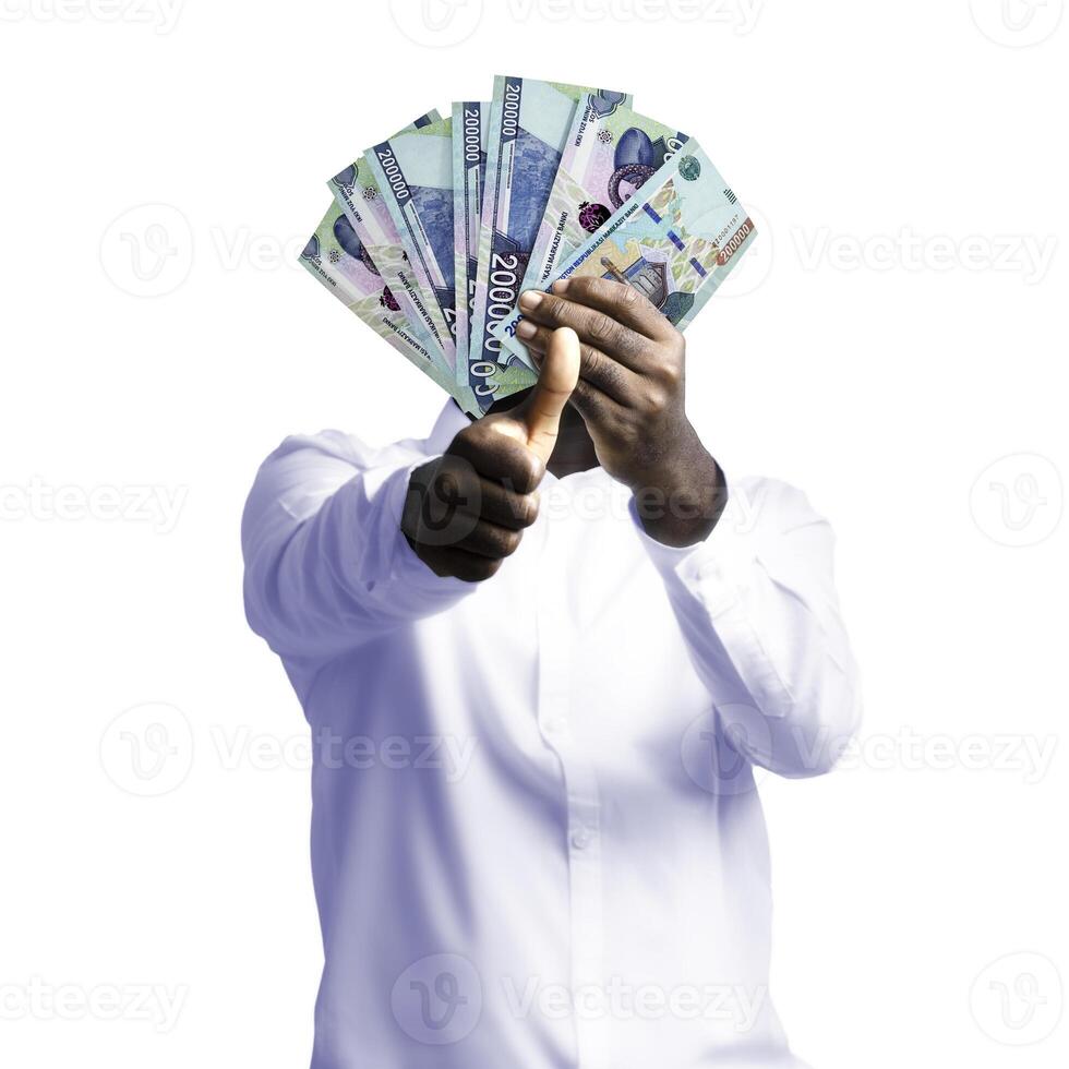 Black person holding Uzbekistani som notes and making thumbs up to the camera. Hand holding Uzbekistan currency notes, 3d rendered money photo