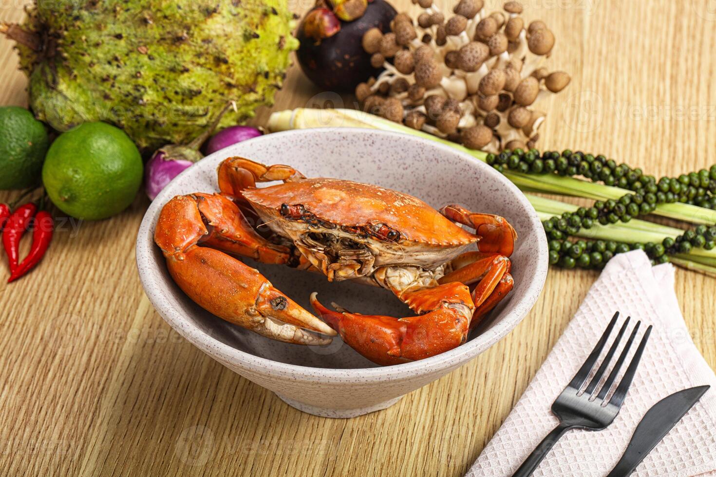 A bowl of food with a crab in it photo