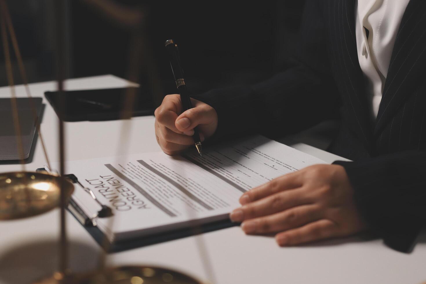 A lawyer signing a contract photo