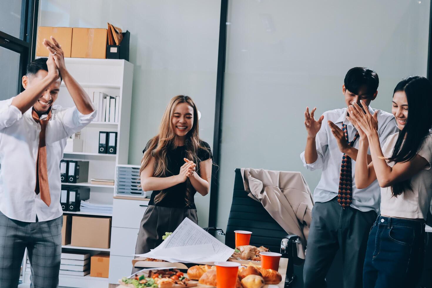 Business people clapping in an office photo