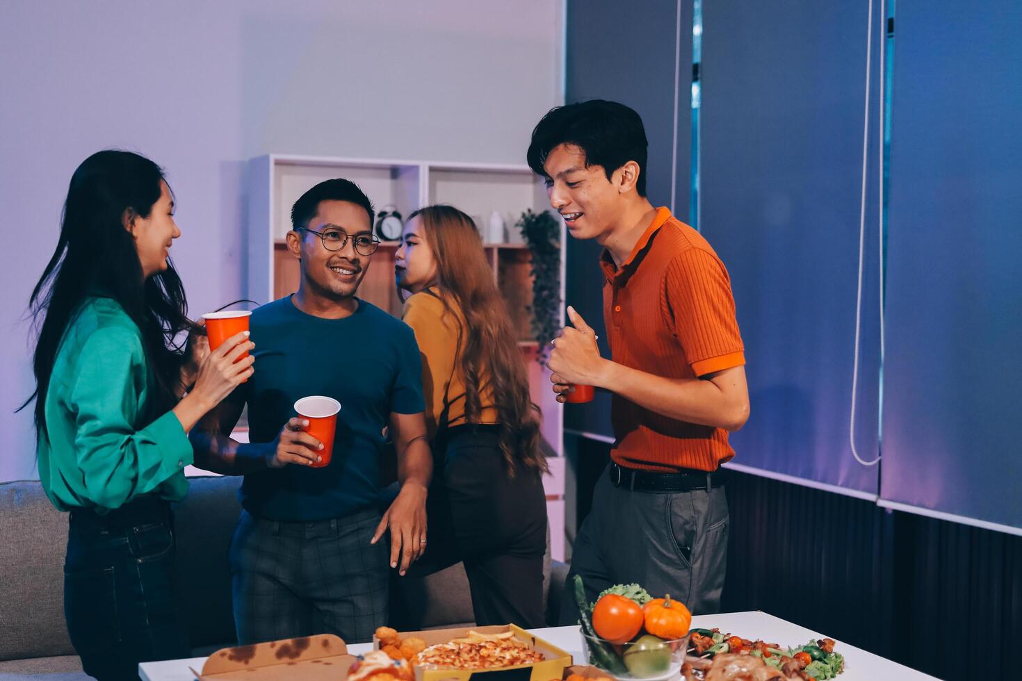 Three friends having a party with pizza and drinks photo