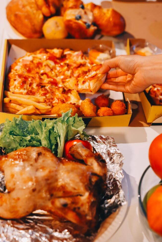 A person's hand holding a pizza photo