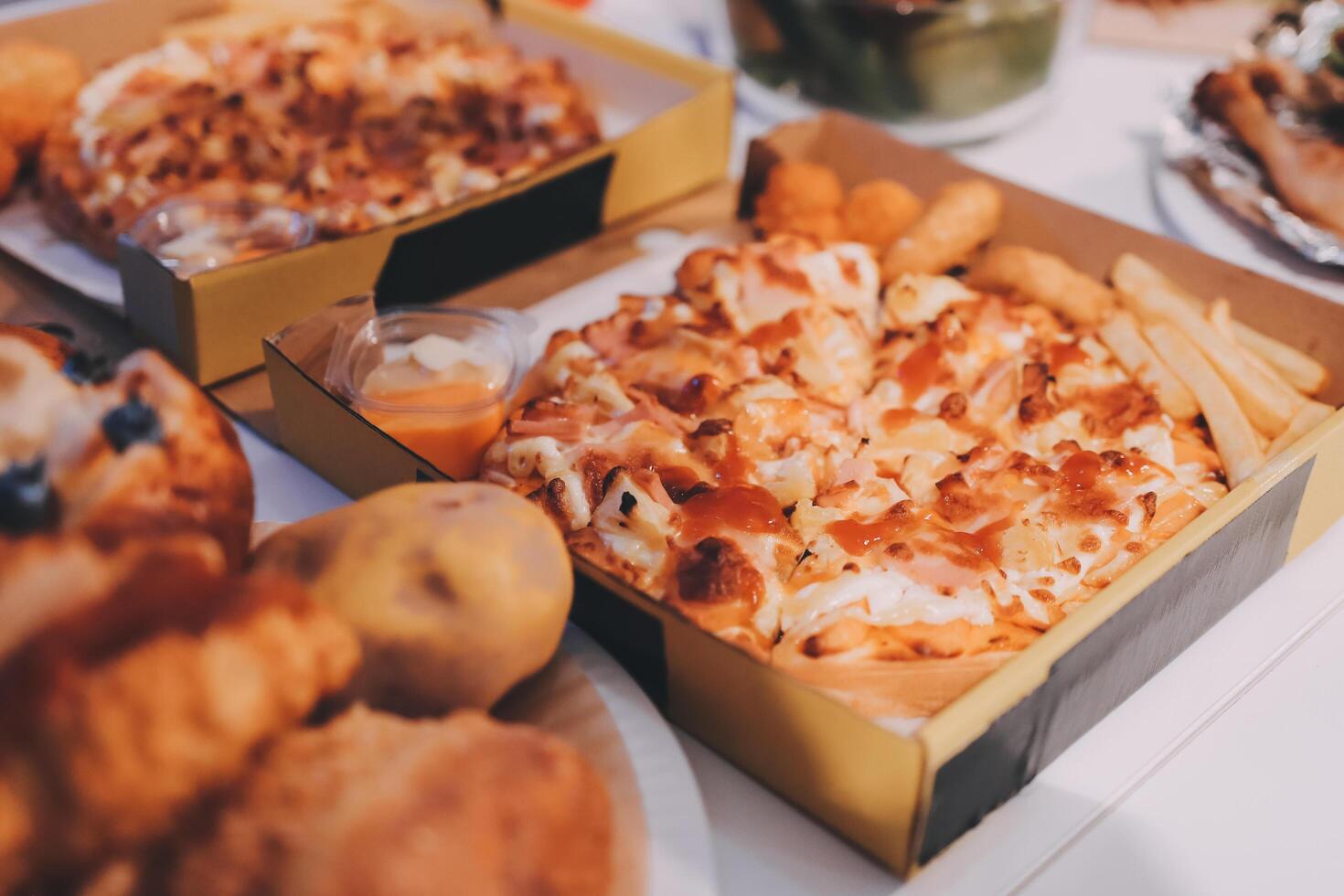 A table with a variety of food in boxes photo