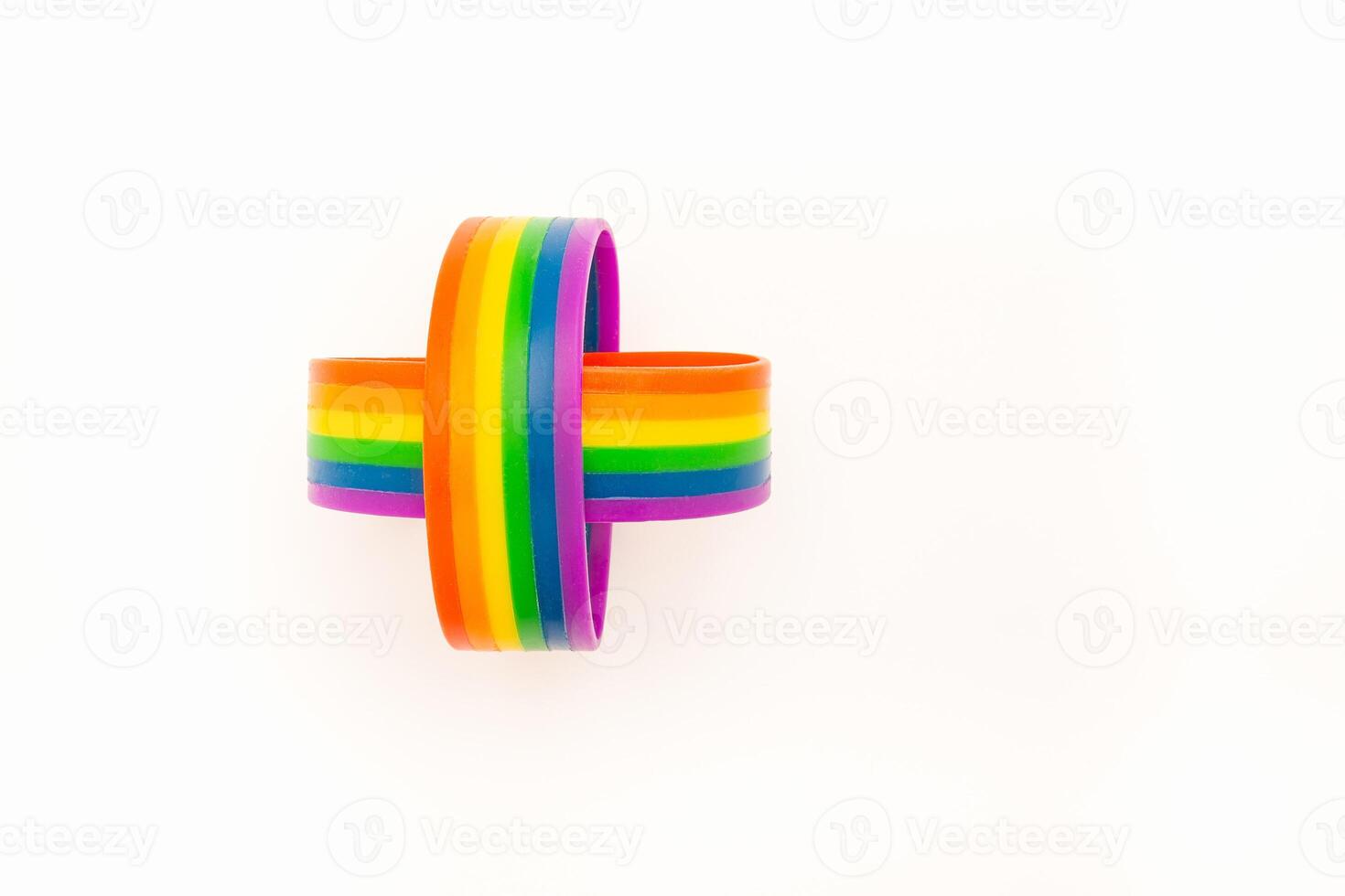 Rainbow patterned wristbands are on a white background. Top view. Close-up. photo