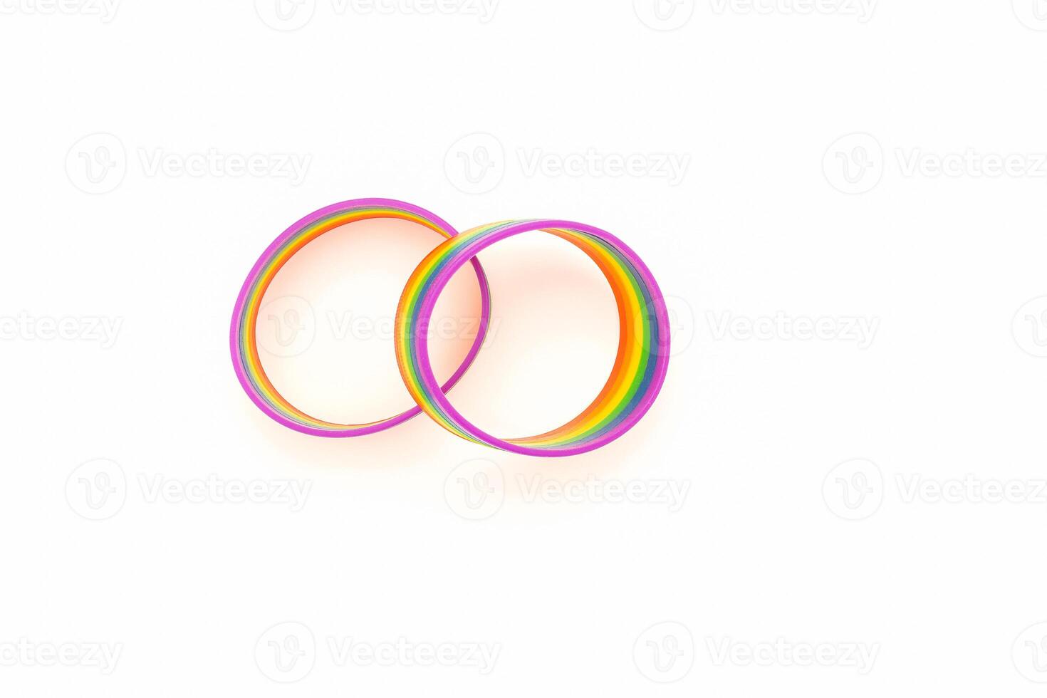 Top view of a rainbow patterned wristbands are on a white background. photo